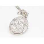 A Victorian silver Aesthetic style oval locket, decorated with a pair of swallows within a landscape