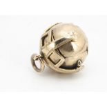 A 9ct gold Masonic spherical ball pendant, opening to reveal a sectioned cross with Masonic emblems,