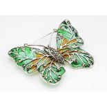 A white metal marcasite and enamel butterfly brooch and pendant, 6cm x 5cm