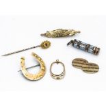 A collection of Edwardian and later gold jewellery, including a horseshoe brooch, an enamel and base