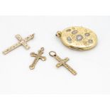 A collection of 9ct gold engraved crosses, and a two coloured gold oval floral decorated locket