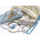 A collection of silver and costume jewellery including a coral stained pendant, a Mexican silver and