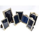 Seven modern silver fronted photograph frames, the largest 22cm high, ranging down to 16cm,