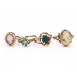 Two 9ct gold cameo rings, an emerald and diamond cluster ring, yellow metal dress ring with stone