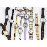 A small collection of ladies wristwatches, including a 9ct gold cased Garrard example, a Timex and