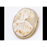A 19th Century shell cameo oval brooch, of woman in bonnet within a 9ct marked gold mount, in box,