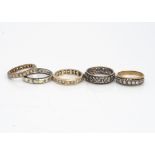 Four 9ct gold paste set full and half eternity rings, and another in silver, 10g (5)