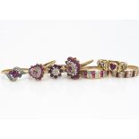 Seven ruby and diamond and colourless gem set dress rings, of various settings including oval