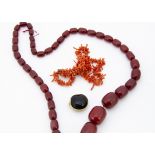 A graduated string of 'cherry amber' beads, 34cm together, 86.8g, largest bead 2.5cm, smallest 1cm