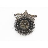 A late 19th/early 20th Century continental filigree target brooch, in white metal marked 830 to