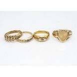 A collection of gold rings, including four 18ct gold rings, comprising a lady's keepers ring, af,