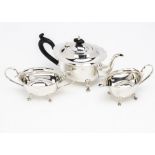 A George V silver three piece tea set by BG, having shaped flared rims, 17ozt, Birmingham 1925