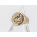 A 9ct gold gentleman's signet ring, with incised crest of a bird upon plinth, ring size P, 9.1g