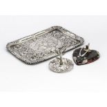 A George V silver dressing table tray, 26cm wide, together with a similar silver ring stand and a
