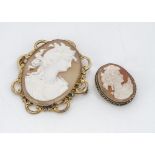 A 19th Century shell cameo oval brooch, with carved profile of a classical maiden with flowers in
