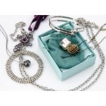 A collection of silver jewellery, including a Tiffany style ring, a hedgehog pendant, various