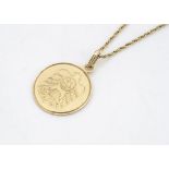 A Middle Eastern 18ct gold medallion and rope twist chain, with engraved design of an eagle