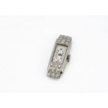 An Art Deco period platinum and diamond cocktail dress wristwatch, 10mm wide, AF, set with eight
