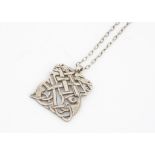An Irish silver Celtic design pendant, with interlocking mythical beasts on a fine silver chain,