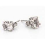 A pair of morganite oval mixed cut silver set ear studs