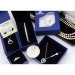 A quantity of Swarovski boxed jewellery, two silver Thalers, various silver jewels and other items