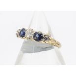 An early 20th Century sapphire and diamond five stone dress ring, the three brilliant cut diamonds