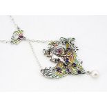 An Art Nouveau style Alphonse Mucha inspired enamel gem set pendant and chain, of femme fatale, 32cm