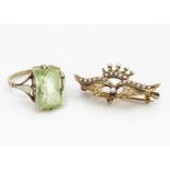 A continental gold and seed pearl double wing brooch, surmounted with a crown, marked 10k,