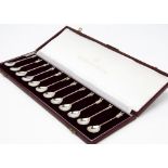 A 1970s set of the Tichborne Spoons, the welve each with figure to terminal, in box with