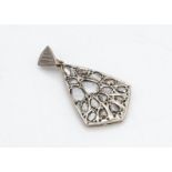 A Russian platinum and gold Art Deco style diamond pendant, the rose cut natural diamonds in a
