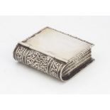 A vintage white metal novelty case, modelled as a book, 4cm