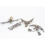 A silver and paste set swallow and frog brooch, the Chester marked silver brooch with a swallow on a