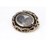 A Victorian yellow metal, enamel and plaited hair mourning brooch, of oval design, 4cm x 3.5cm, 15g