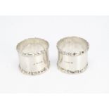 A pair of Edwardian silver napkin rings, 1.9ozt (2)