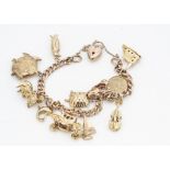 A 9ct gold curb link charm bracelet, with heart shaped engraved padlock clasp, bracelet marked 9ct