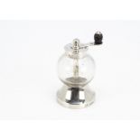 A Victorian glass and silver pepper mill by Hukin & Heath, with glass spherical well and flared