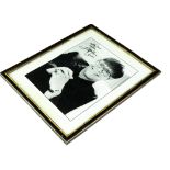 Elton John / autograph, a black and white publicity photo of Elton John with a signature, framed and