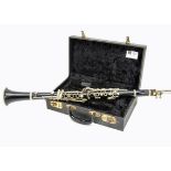 Clarinet, a clarinet stamped F. Buisson Model 90 Evette appears in sound condition housed in quality