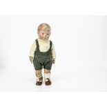 A Kathe Kruse Doll No 1, with painted cloth moulded head, painted brown eyes and light brown hair,