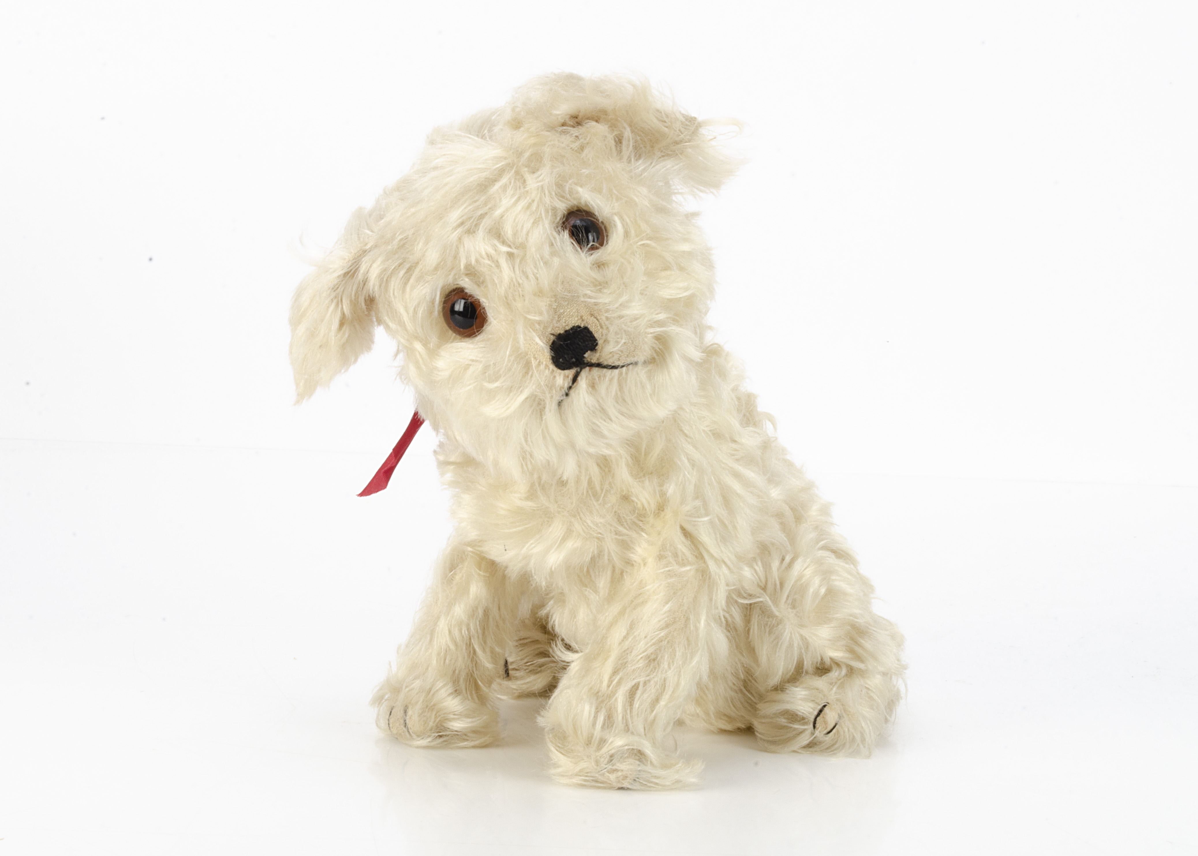 An unusual Steiff white mohair Molly dog 1930s, with long white mohair, brown and black glass