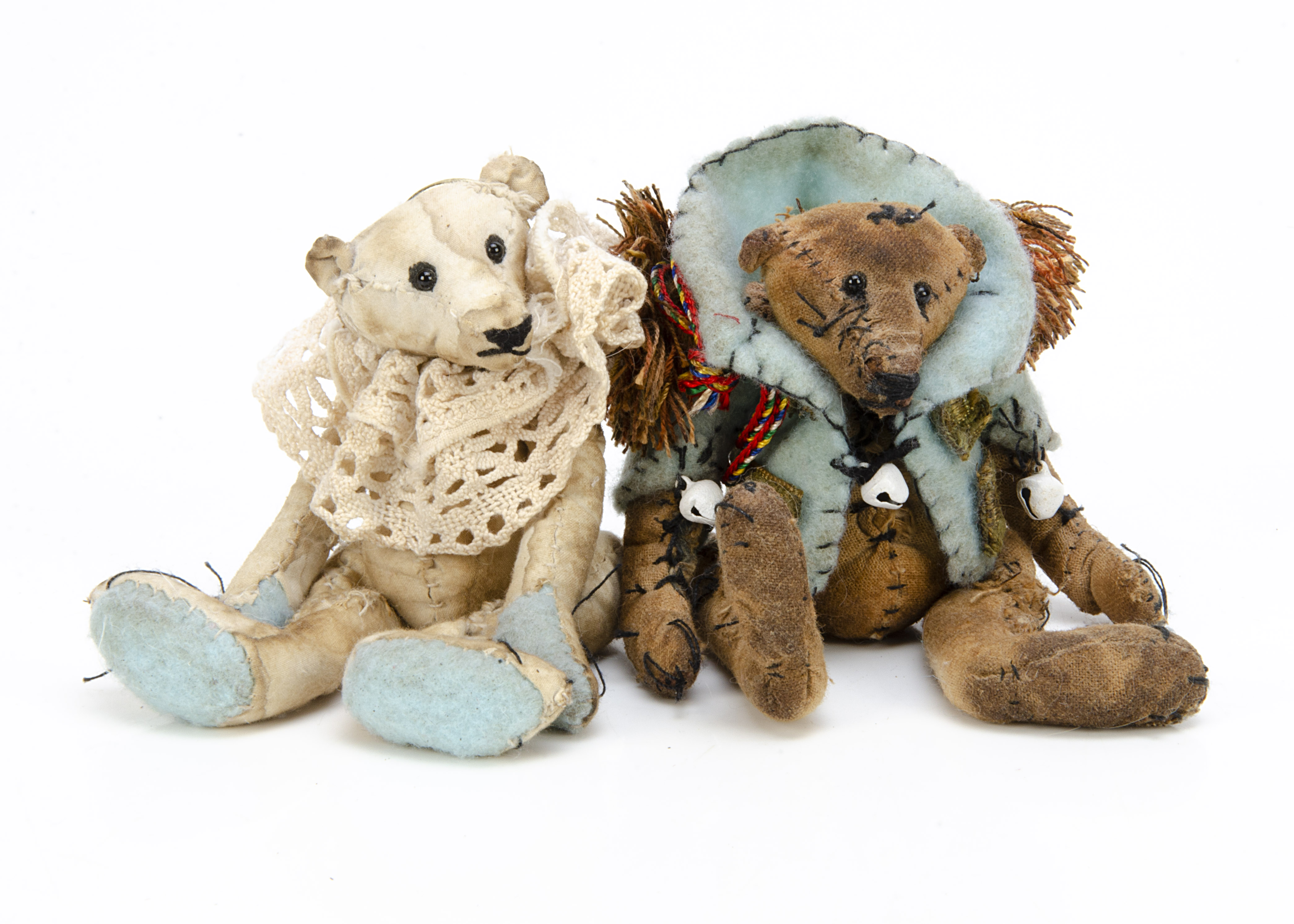 Two miniature artist teddy bears, both made from distressed cotton, one white and one beige,