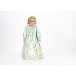 A Simon & Halbig for Kämmer & Reinhardt child doll, with brown lashed sleeping eyes, blonde mohair