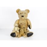 A small post-war Chad Valley teddy bear, with blonde mohair, orange and black glass eyes, black