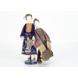 Two Chinese Opera Dan dolls, with composition painted white faces, elongated fingers, elaborate