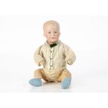 An Armand Marseille 500 character baby, with blue intaglio eyes, closed slightly smiling mouth,