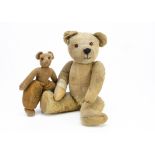 Two British teddy bears, a 1920s blonde mohair teddy bear, probably Chad Valley with orange and