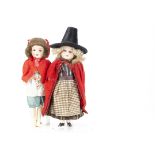 Two small German bisque headed dolls, an Armand Marseille 390 dressed in Welsh traditional costume