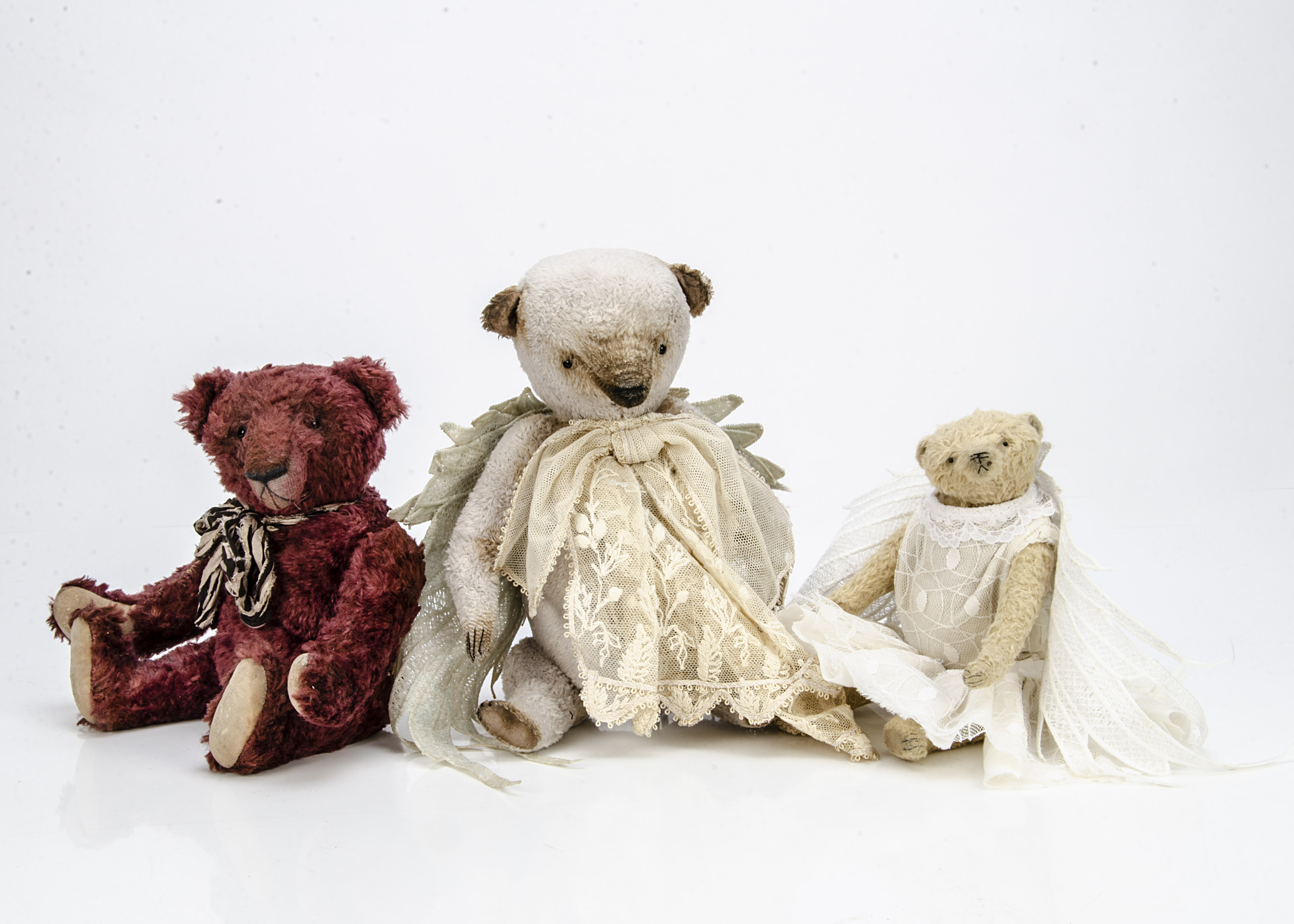 Three artist teddy bears, of artificial silk plush, one grey with swivel head, jointed limbs, lace