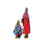 A Maasai tribe carved wooden man and women, with carved head, hands and feet, clothes and bead