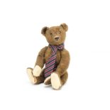 'Brown Boy' a 1920s Steiff teddy bear, with brown mohair, brown backed glass eyes, pronounced